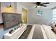 Well-lit bedroom with a ceiling fan, wall-mounted TV, and modern decor at 2829 9Th W Ave, Bradenton, FL 34205