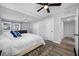 This spacious bedroom features wood floors, ceiling fan, and ensuite entrance at 2829 9Th W Ave, Bradenton, FL 34205