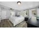 Bright bedroom features wood floors, ceiling fan, and ensuite bathroom at 2829 9Th W Ave, Bradenton, FL 34205