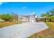 Charming single-story home with a well-maintained lawn, large driveway, garage, and attached carport at 2829 9Th W Ave, Bradenton, FL 34205