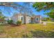 Charming home exterior with neutral siding, manicured landscaping, and a welcoming entrance at 2829 9Th W Ave, Bradenton, FL 34205