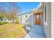 Charming home featuring a welcoming front entrance with a detailed door, steps, landscaping, and a well-manicured lawn at 2829 9Th W Ave, Bradenton, FL 34205