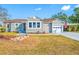 Traditional-style home featuring a tidy front yard, driveway and a visible American flag, showcasing curb appeal at 2829 9Th W Ave, Bradenton, FL 34205