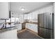 Modern kitchen boasts granite counters, stainless steel appliances, and ample cabinet space at 2829 9Th W Ave, Bradenton, FL 34205