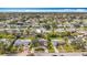 A picturesque aerial shot of a residential area with houses surrounded by trees at 3124 61St N Ln, St Petersburg, FL 33710