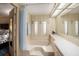 Bathroom with bathtub, small windows, and a long vanity at 35020 Colony Hills Dr, Zephyrhills, FL 33541