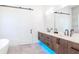 Bright bathroom with double vanity, marble countertop, and modern fixtures at 4604 W Lowell Ave, Tampa, FL 33629