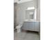 Modern bathroom with sleek vanity, glass shower, and contemporary fixtures at 4604 W Lowell Ave, Tampa, FL 33629