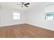 Bright bedroom with wood floors, large windows, and neutral walls at 4604 W Lowell Ave, Tampa, FL 33629