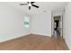 Bright bedroom with wood floors, large window, and neutral walls at 4604 W Lowell Ave, Tampa, FL 33629