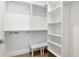 Walk-in closet with built-in shelving and hanging racks at 4604 W Lowell Ave, Tampa, FL 33629