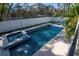 Inviting pool with a spa, patio, and comfortable lounge chairs create a perfect setting for relaxation and outdoor enjoyment at 4604 W Lowell Ave, Tampa, FL 33629