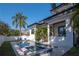 Backyard pool and jacuzzi featuring a sleek design and modern patio furniture at 4604 W Lowell Ave, Tampa, FL 33629
