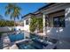 Beautiful backyard with pool, spa, and modern home design, perfect for outdoor entertaining and relaxation at 4604 W Lowell Ave, Tampa, FL 33629