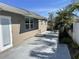 Exterior view of the home featuring a patio area, landscaped yard, and palm trees at 561 Park S St, St Petersburg, FL 33707