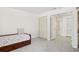 Clean bedroom with closet and neutral carpet; simple and comfortable at 70 Deerpath Dr, Oldsmar, FL 34677