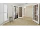 Living room featuring tile flooring, sliding door and view to screened-in patio at 70 Deerpath Dr, Oldsmar, FL 34677