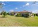 Beautiful backyard featuring a well-manicured lawn and lovely landscaping at 11563 Callisia Dr, Odessa, FL 33556