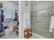Bathroom featuring a glass-enclosed shower next to an organized walk-in closet at 11563 Callisia Dr, Odessa, FL 33556