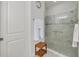 Bathroom showcasing a glass-enclosed shower with stylish tile work and neutral paint at 11563 Callisia Dr, Odessa, FL 33556