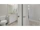 Stylish bathroom showcasing a granite countertop vanity and tiled floor at 11563 Callisia Dr, Odessa, FL 33556