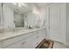 Bathroom featuring double vanity, granite countertops, and modern lighting at 11563 Callisia Dr, Odessa, FL 33556