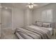 Comfortable bedroom featuring neutral tones, window shutters, and ceiling fan at 11563 Callisia Dr, Odessa, FL 33556