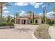 Stunning clubhouse exterior with palm trees and beautiful landscaping at 11563 Callisia Dr, Odessa, FL 33556