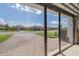 Screened-in garage offering a view of a quiet neighborhood street at 11563 Callisia Dr, Odessa, FL 33556