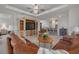Open concept living room with tile floors, media center, and seating for entertaining at 11563 Callisia Dr, Odessa, FL 33556