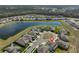 The property is near a lake, cul-de-sac, and lush landscaping in a serene neighborhood at 12779 Fisherville Way, Riverview, FL 33579