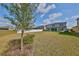 Expansive backyard featuring a white fence and covered patio, perfect for outdoor gatherings at 12779 Fisherville Way, Riverview, FL 33579