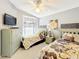 Bedroom featuring two twin beds with floral comforters and decorative wall art above each bed at 13252 Norman Cir, Hudson, FL 34669