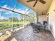 Spacious screened lanai with brick flooring and golf course views, perfect for outdoor entertaining at 13252 Norman Cir, Hudson, FL 34669