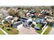 Aerial view of a home with solar panels, fenced yard, and inviting swimming pool at 15701 Springmoss Ln, Tampa, FL 33624