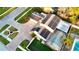 Aerial view of a home with solar panels, covered pool, and manicured landscaping at 15701 Springmoss Ln, Tampa, FL 33624