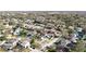 Aerial view of a neighborhood with mature trees with a pin on top of the house at 15701 Springmoss Ln, Tampa, FL 33624