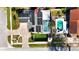 An aerial view of a home with solar panels and a screened-in pool at 15701 Springmoss Ln, Tampa, FL 33624