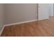 Clean, neutrally decorated bedroom with wood floors and ample natural light creates a peaceful atmosphere at 15701 Springmoss Ln, Tampa, FL 33624