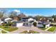 Lovely home featuring a brick driveway, well-manicured landscaping, and solar panels for energy efficiency at 15701 Springmoss Ln, Tampa, FL 33624