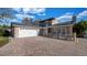 Beautifully landscaped home featuring a wide driveway and a two-car garage at 15701 Springmoss Ln, Tampa, FL 33624