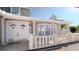 Inviting front entrance featuring double doors, columns, and decorative white railing at 15701 Springmoss Ln, Tampa, FL 33624