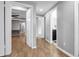 Hallway leads to bedrooms and bathroom, offering a glimpse into the home's layout at 15701 Springmoss Ln, Tampa, FL 33624