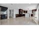 Large open-concept layout with a stylish bar area and a view into the modern kitchen at 15701 Springmoss Ln, Tampa, FL 33624