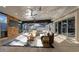 Spacious living area with modern furnishings, ceiling fans, and sliding doors to the pool at 15701 Springmoss Ln, Tampa, FL 33624