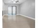 Bright living room featuring tile floors and neutral paint at 15701 Springmoss Ln, Tampa, FL 33624