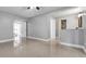 Expansive living room featuring tile floors with modern paint at 15701 Springmoss Ln, Tampa, FL 33624