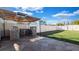 An outdoor kitchen featuring a grill, sink, and countertop, offers a perfect setting for outdoor dining at 15701 Springmoss Ln, Tampa, FL 33624