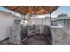 An outdoor kitchen boasts a grill, sink, and countertop, offering a perfect space for outdoor dining and entertaining at 15701 Springmoss Ln, Tampa, FL 33624