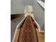Carpeted staircase featuring wooden steps, white risers, and a decorative carpet runner at 15701 Springmoss Ln, Tampa, FL 33624